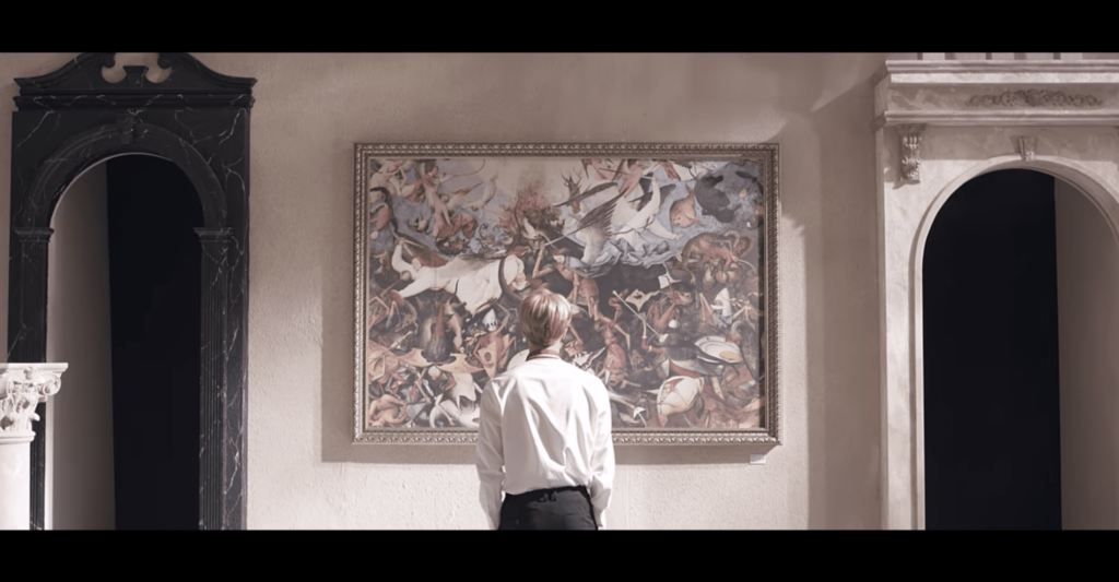 Figure viewing ornate framed artwork in classical interior - BTS Blood Sweat & Tears video still