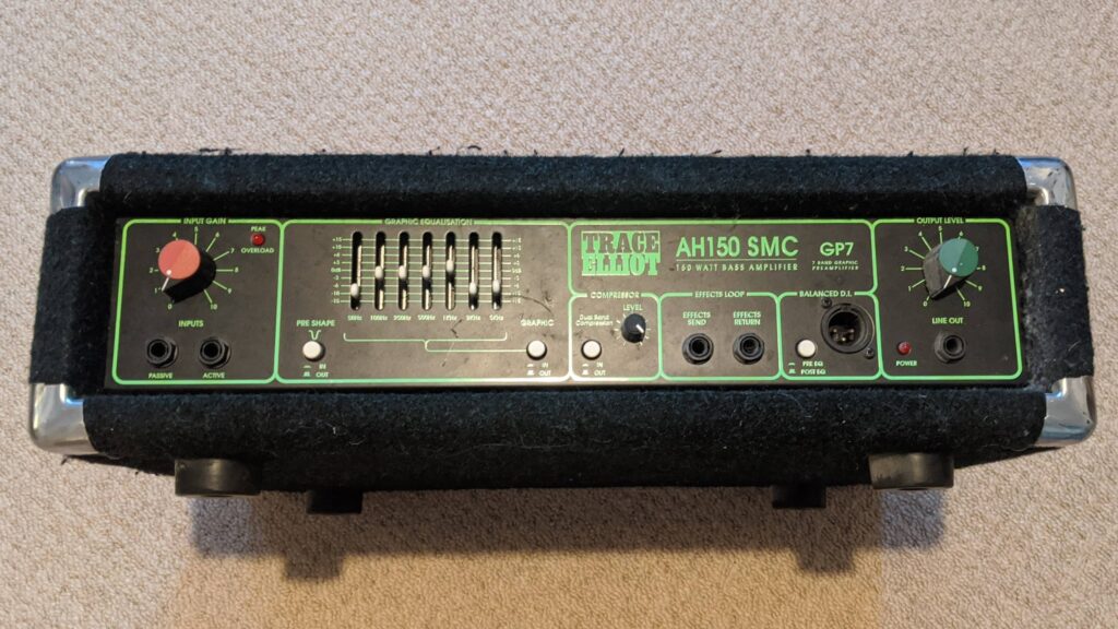 TRACE AH150 SMC guitar amplifier with black finish on carpet, showing controls and specifications panel