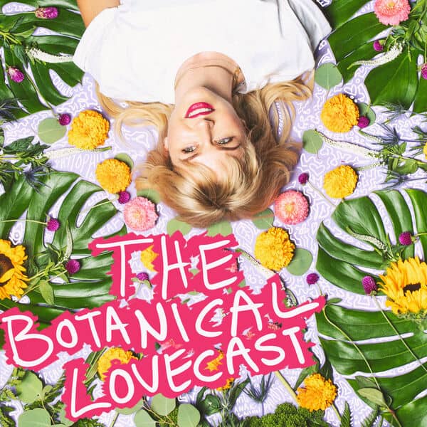 The Botanical Lovecast podcast cover - A blonde woman lying on her back, smiling, surrounded by monstera leaves and various colorful flowers. Text: THE BOTANICAL LOVECAST.