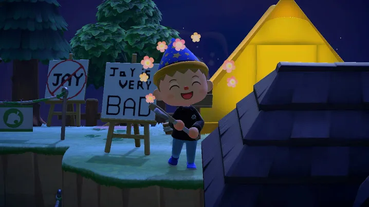 Animal Crossing screenshot of character at night beside yellow tent with pink flowers blooming nearby and signs showing personality on the ground