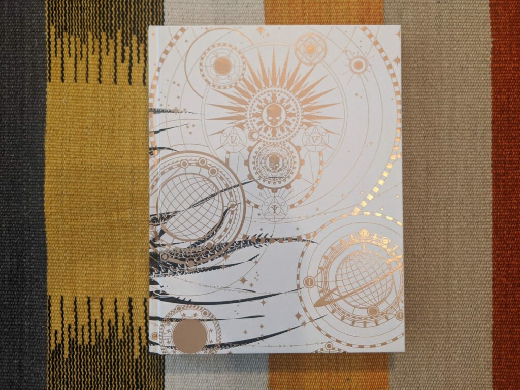 Geometric line drawing of celestial and mechanical designs with interlocking circles, planets, and steampunk-inspired elements in cream and brown ink