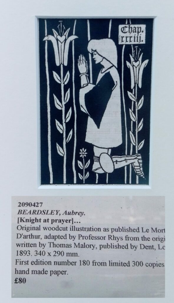 Medieval woodcut illustration of knight at prayer with floral borders, labeled Chap. xxxiii from Le Morte D'Arthur adapted by Professor Rhys