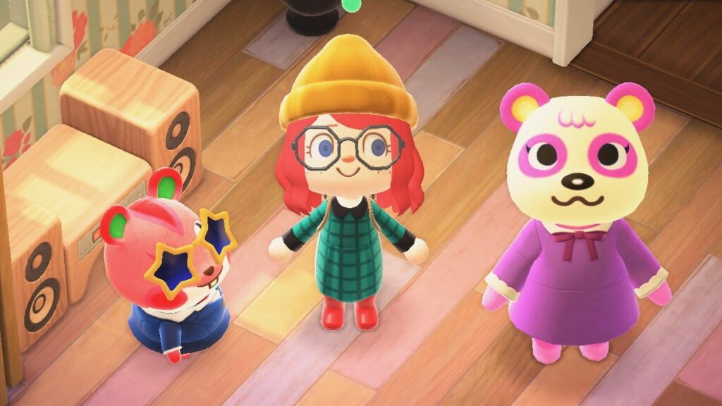 Three game characters - red-haired character with yellow hat, colorful character, and pink character with large heart-shaped eyes