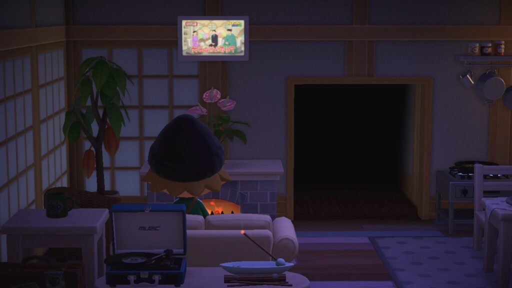 Screenshot of animated character in bedroom at night with computer, plants, and furniture