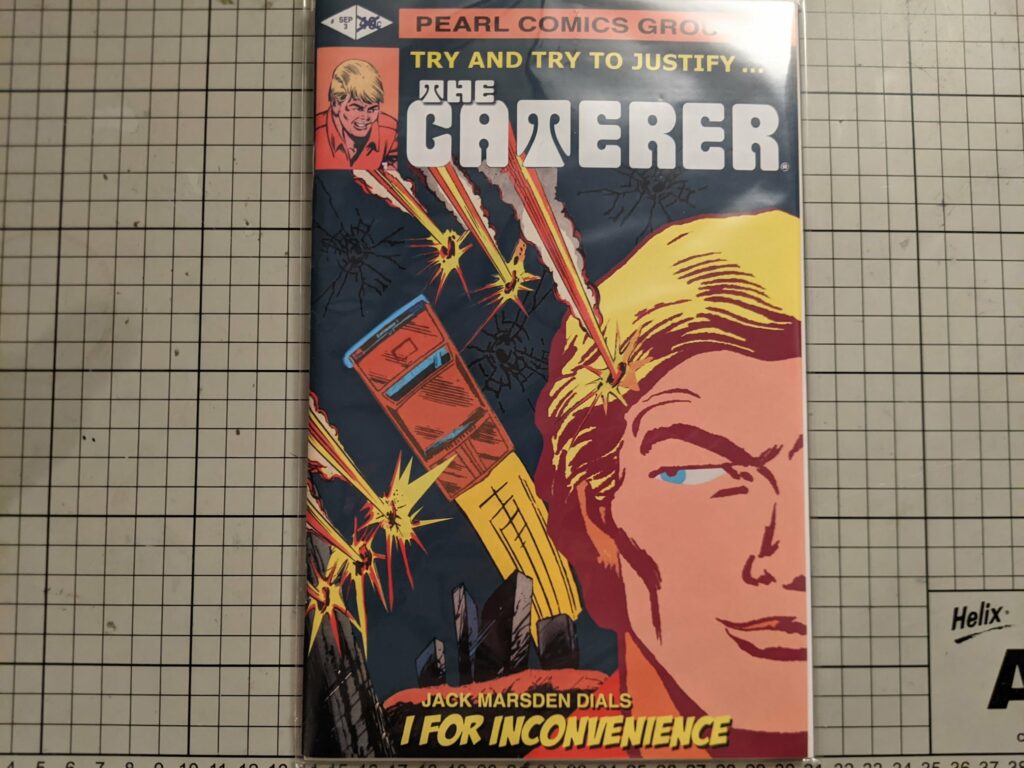 Comic book cover titled "The Gamerer" by Pearl Comics Group being held up against a grid patterned surface