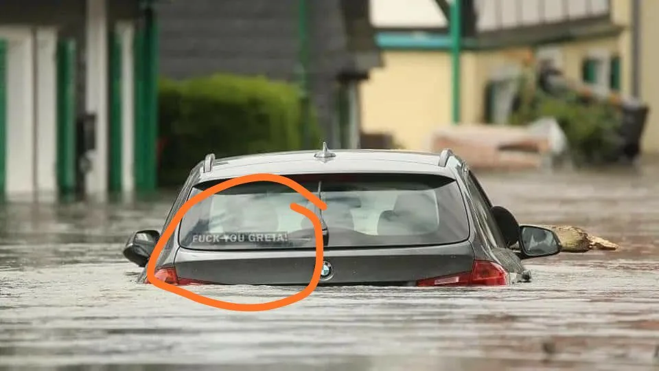 Submerged car in flood water with registration plate visible, orange circle highlights part of the vehicle