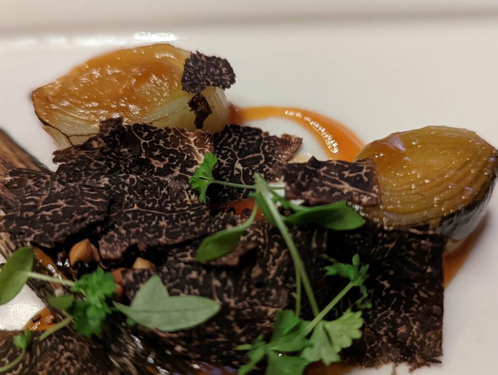 Gourmet chard leek and truffle, severed on an orange sauce