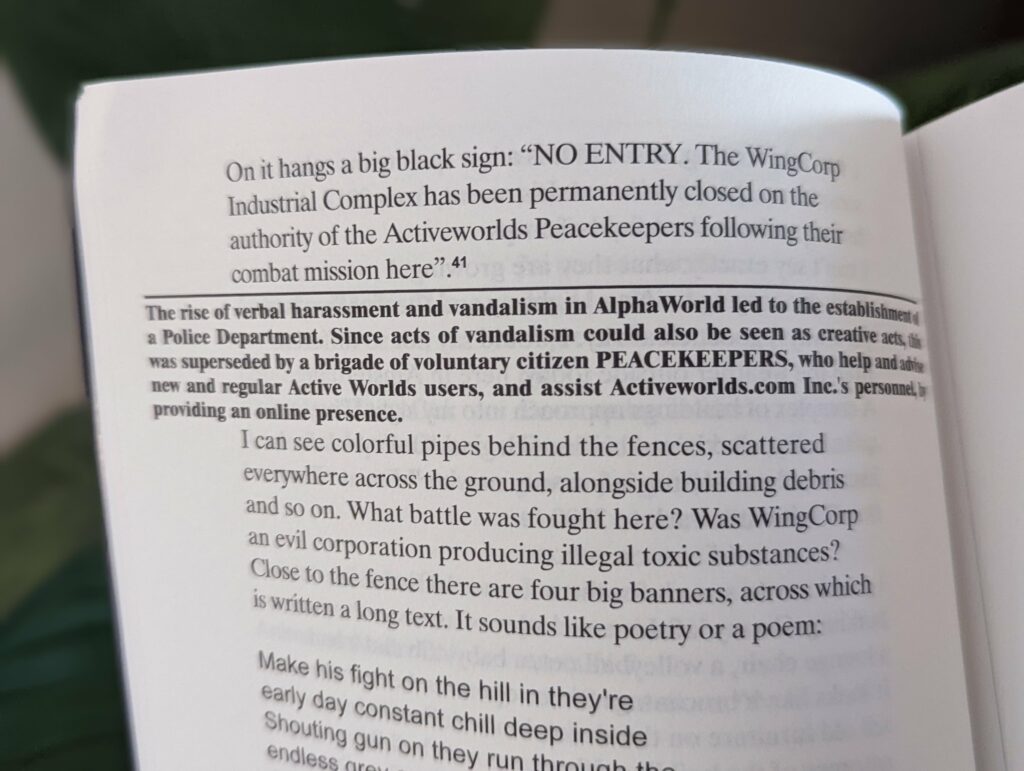A close-up of a book page with text about Activeworlds Peacekeepers and the closure of the WingCorp Industrial Complex.