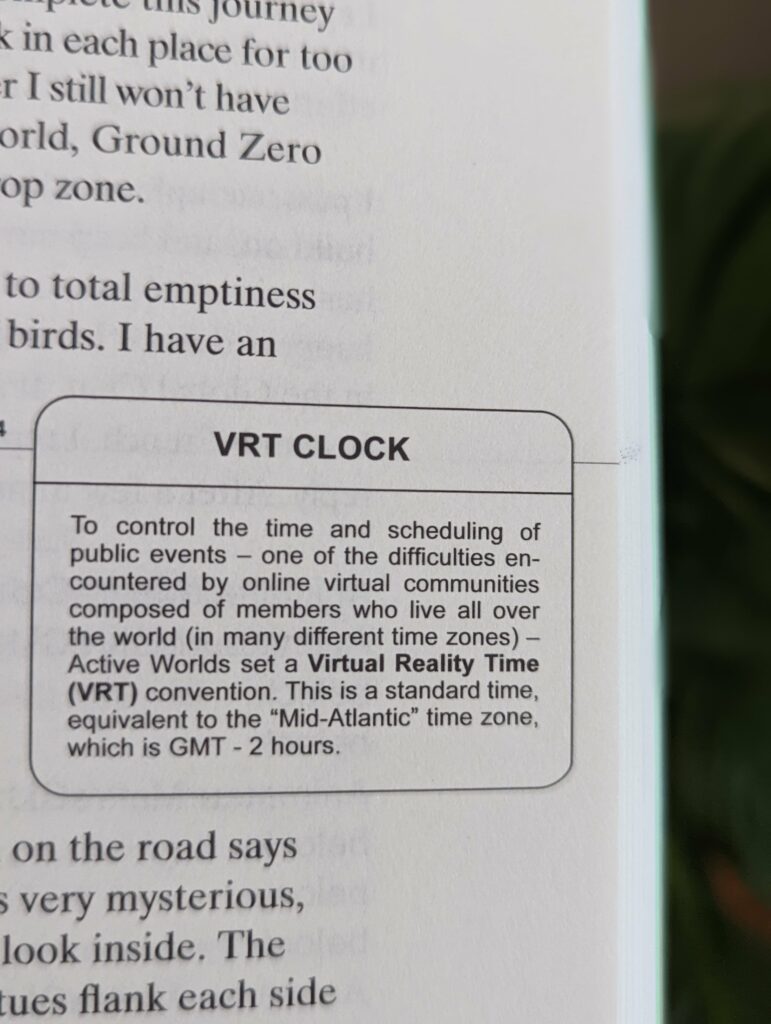 A printed text box titled VRT CLOCK, defining Virtual Reality Time as a standard GMT - 2 hour zone for the Active Worlds online community.