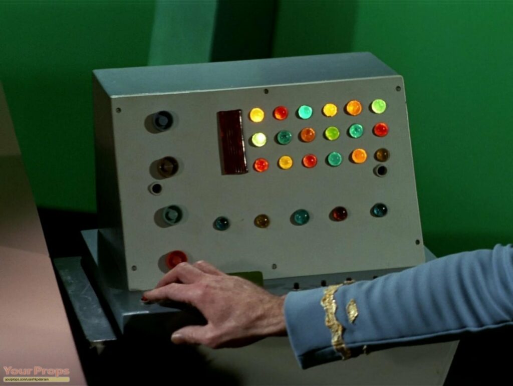 Featured image for Star Trek The Original Series Desktop Computer - A grey control console with rows of glowing multicolored circular buttons.