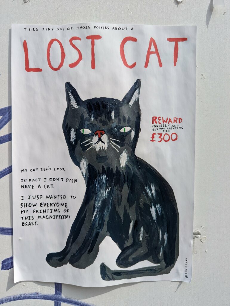 A hand-painted poster of a black cat parodying 'Lost Cat' flyers, stating the cat isn't lost and offering the painting for sale for £300.