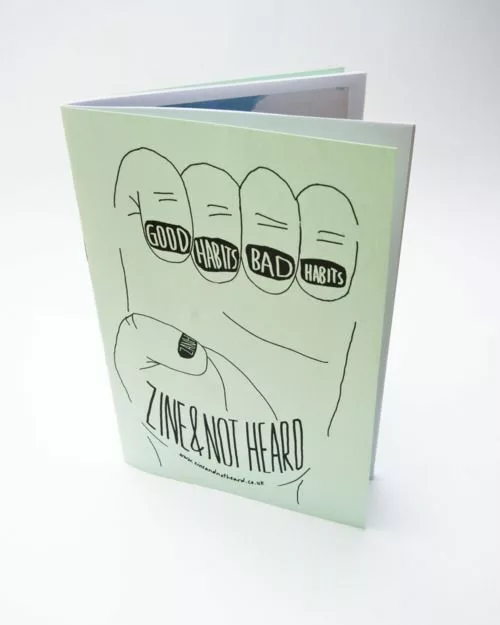 Light green Zine & Not Heard booklet featuring a hand-drawn fist with Good Habits Bad Habits tattooed across the knuckles.