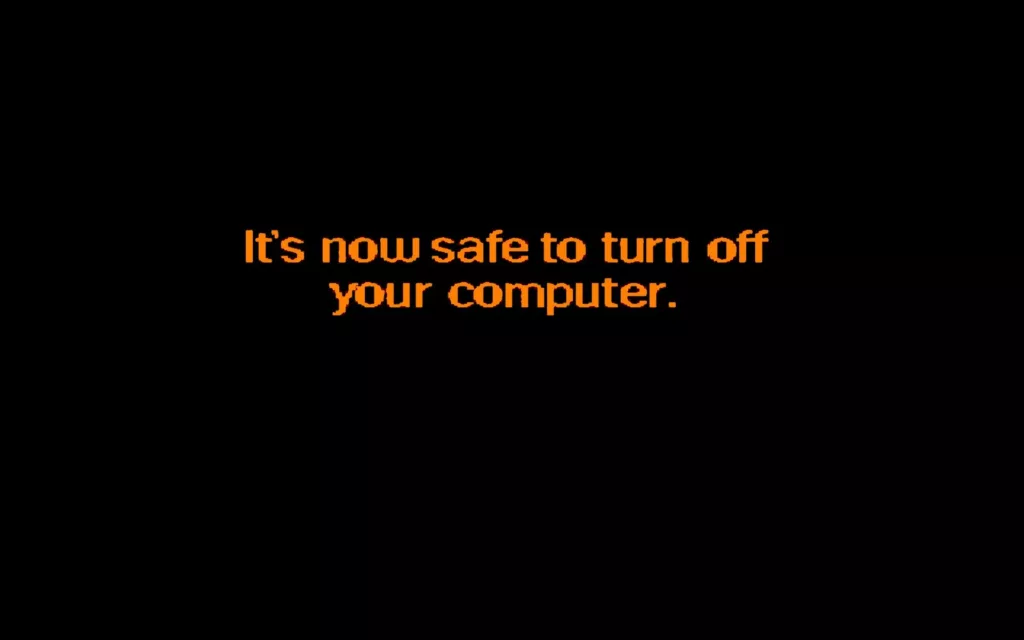 Featured image for It is now safe to turn your computer off - orange pixelated text on a black background reading: It's now safe to turn off your computer.