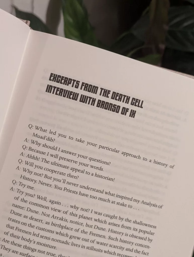 A book page with the bold heading EXCERPTS FROM THE DEATH CELL INTERVIEW WITH BRONSO OF IX above dialogue regarding Muad’dib and Dune.