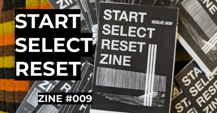 Featured image for Start Select Reset Zine #009 - A pile of black and white zines with a textured graphic cover on a striped fabric background.