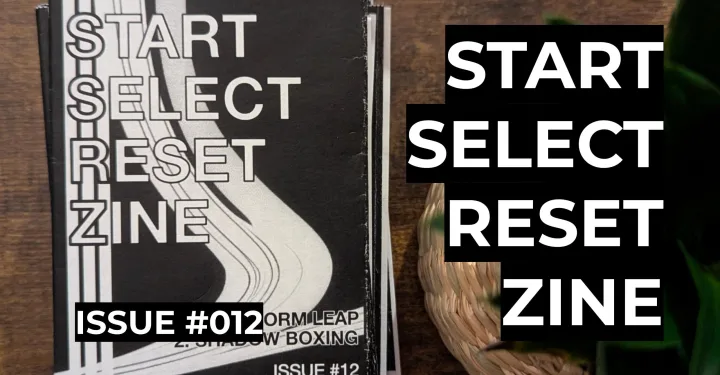 Featured image for Start Select Reset Zine Issue #012 - A black and white zine cover on a wooden table with bold digital text reading Start Select Reset Zine.