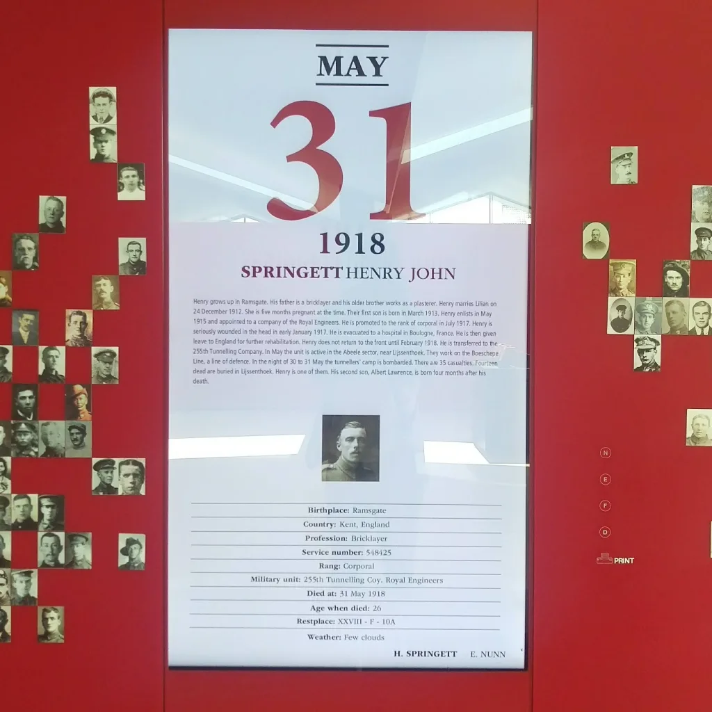 A commemorative panel for Henry John Springett dated May 31, 1918, flanked by small soldier portraits on a bright red background.
