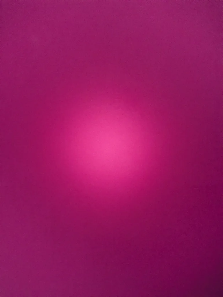 Long exposure shot of a vibrant magenta surface with a bright, glowing circular hotspot in the center.