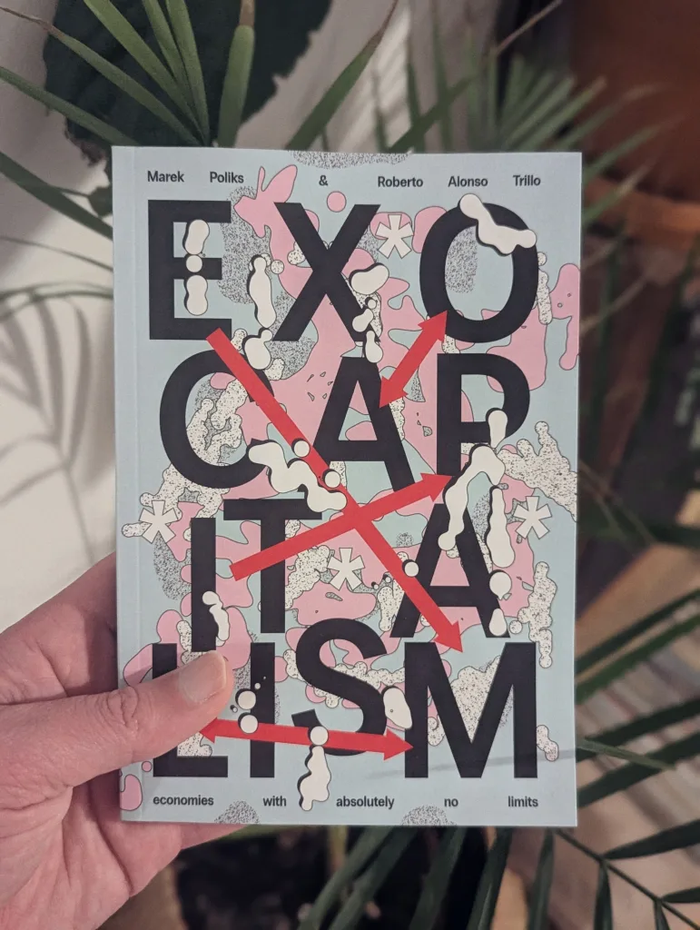 A hand holding the book Exocapitalism by Marek Poliks & Roberto Alonso Trillo, with bold black text and red arrows against green plant leaves.