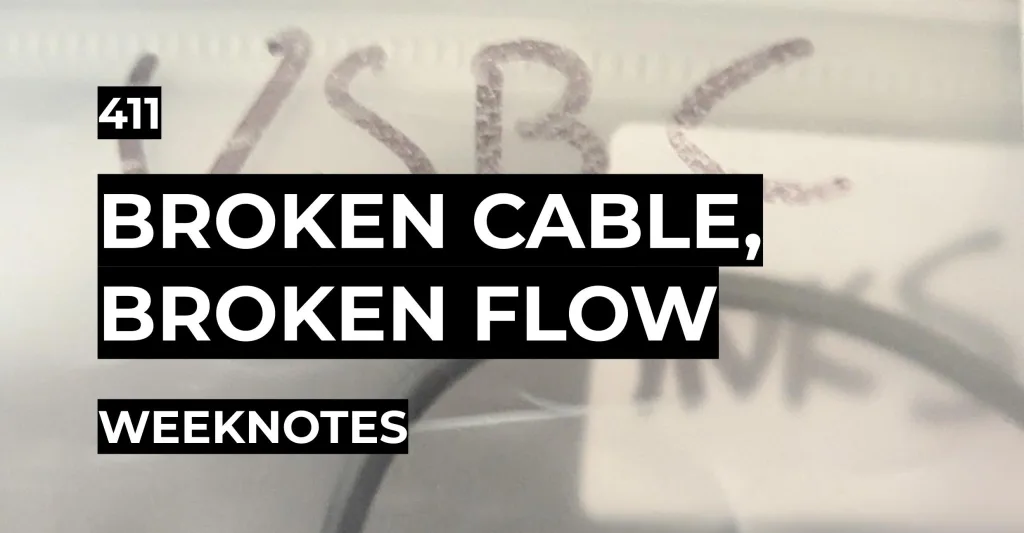 Featured image for Broken Cable, Broken Flow - Weeknotes 411 over a blurry photo of a plastic bag with handwritten text reading USB C.