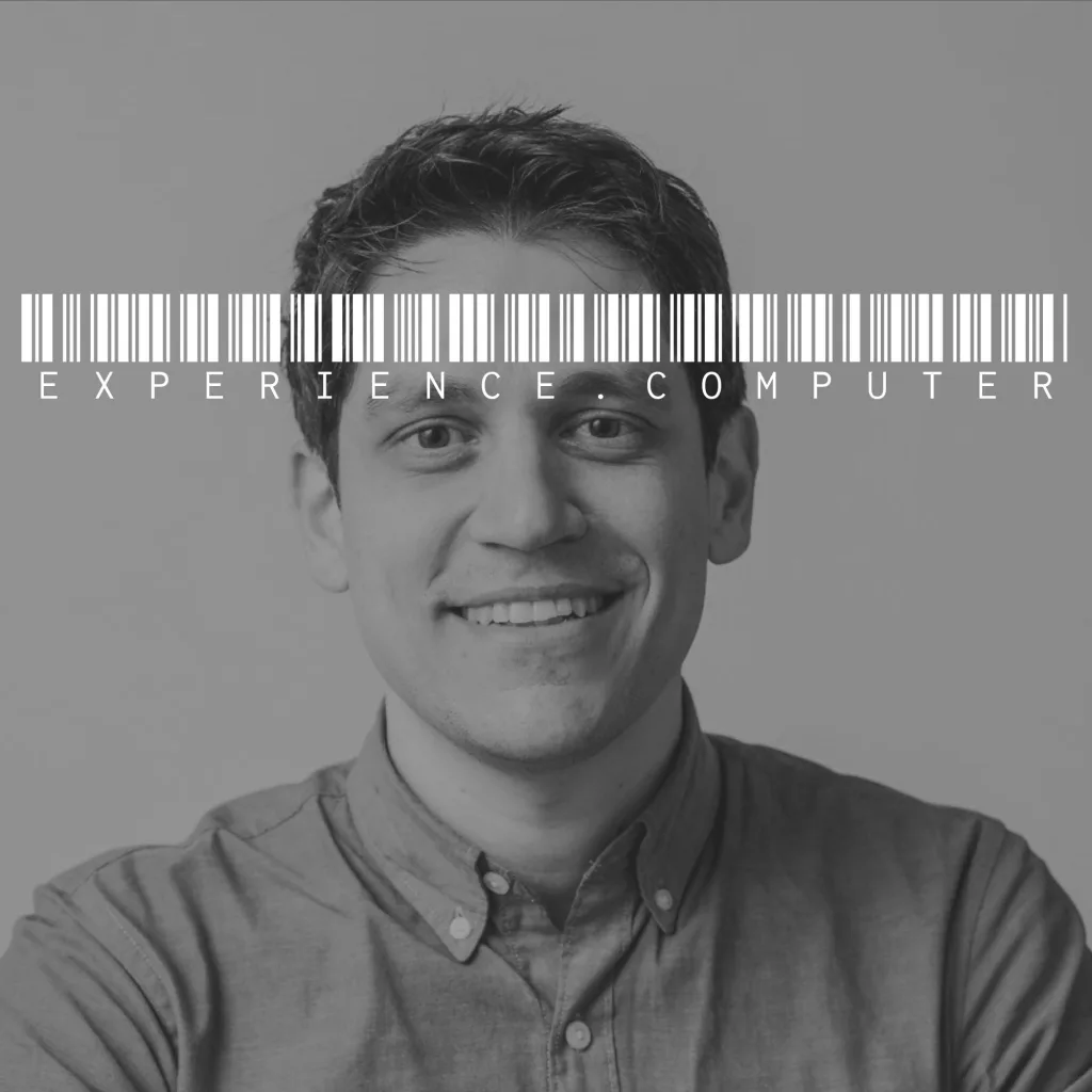 experience.computer podcast cover - A grayscale portrait of Marco smiling with a white barcode over his eyes and the text EXPERIENCE.COMPUTER.
